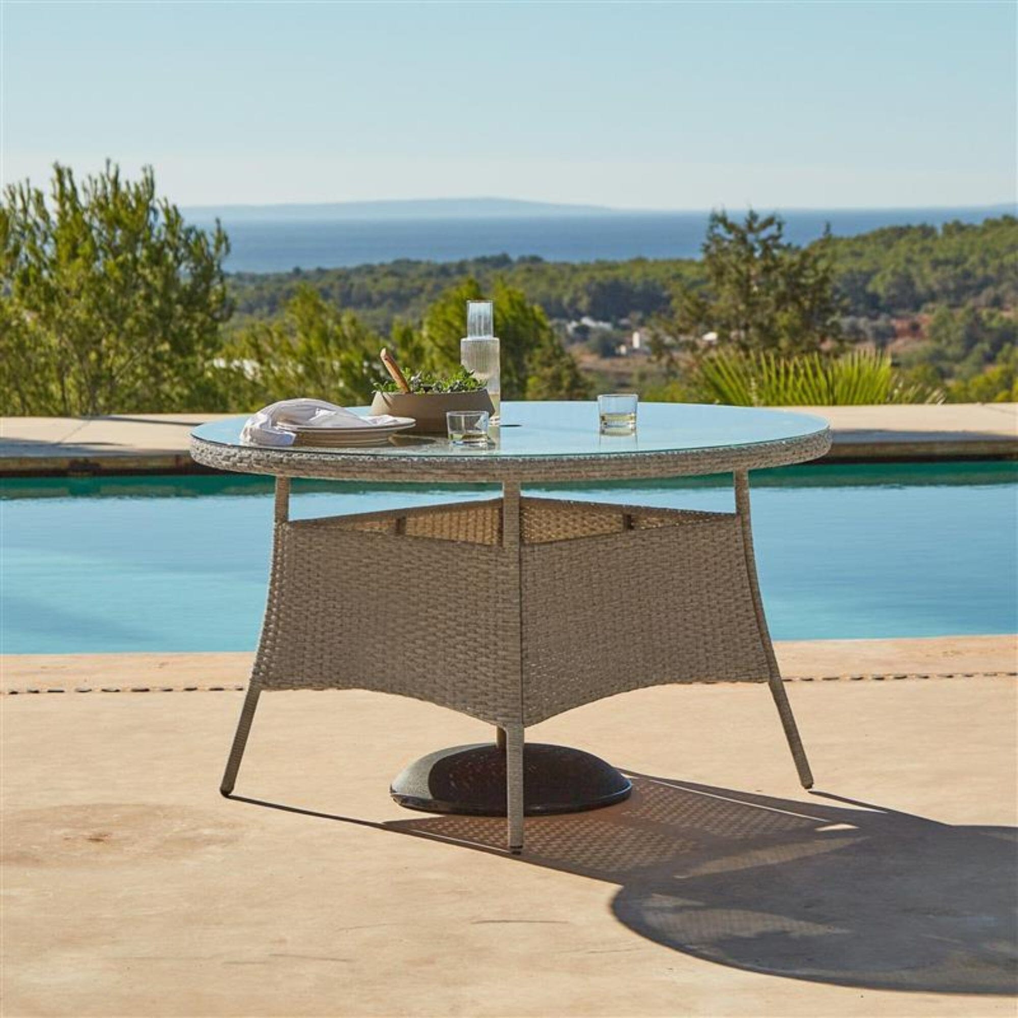 Kemble 6 Seater Round Rattan Garden Dining Table - Light Grey with Clear Glass Top